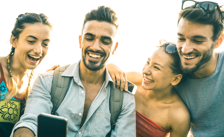 college students looking at phone